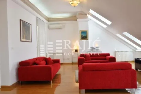 Spacious bright living room with red sofa sets in the attic. - image 19