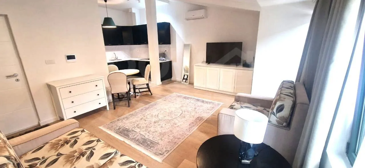 Spacious living room connected with dining area and kitchen.