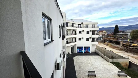 View of the courtyard and residential building facade from the balcony. - image 12