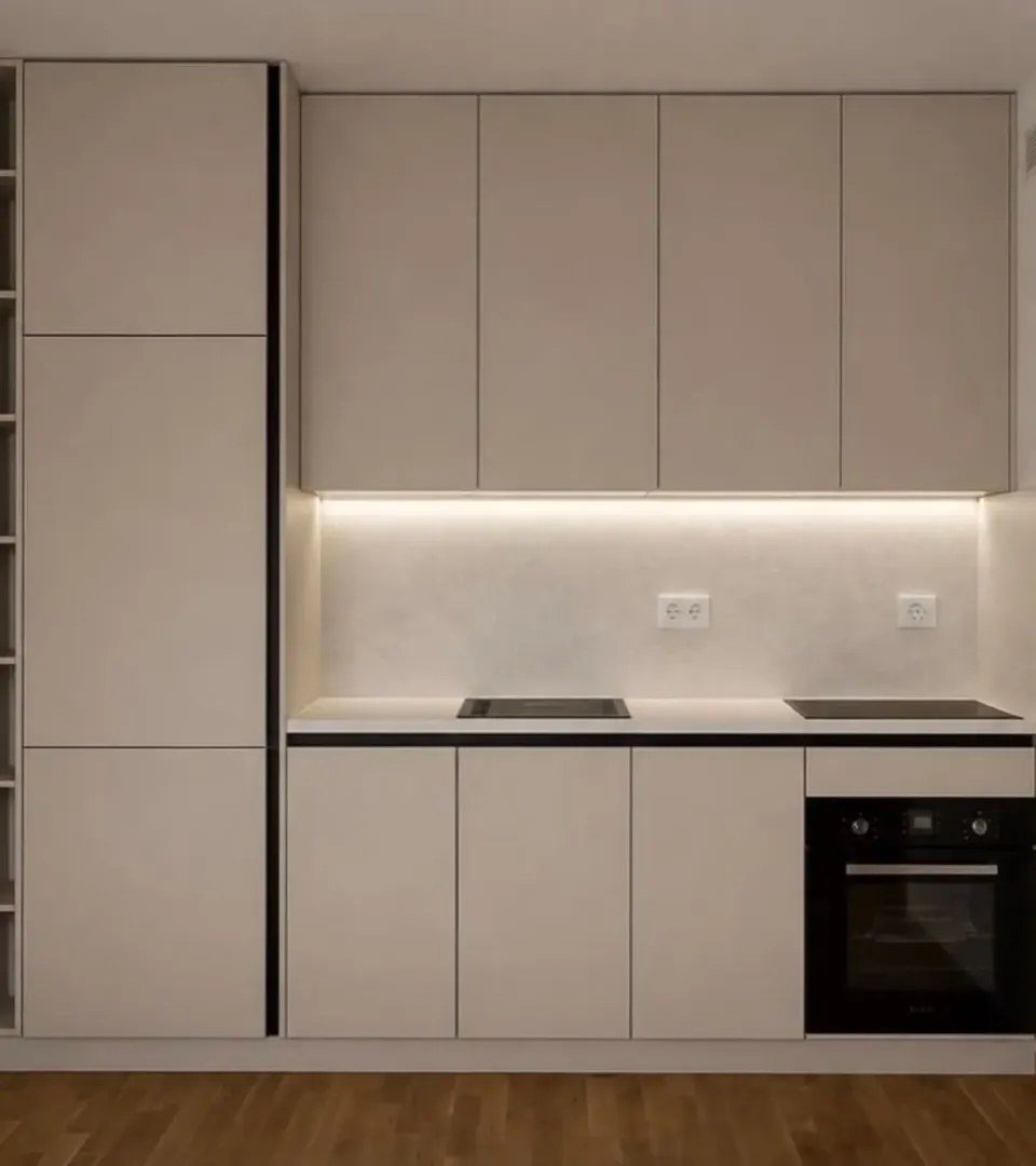 Modern kitchen with built-in cabinetry and appliances.