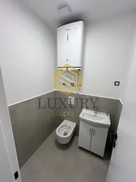 Small bathroom with sanitary ware and a water heater. - image 4