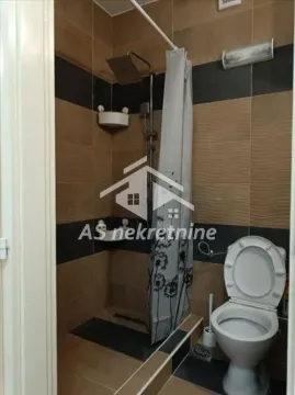 Bathroom with a shower cabin and toilet. - image 17