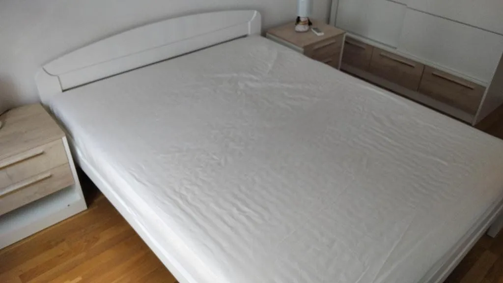 Bedroom with a double bed and nightstands.