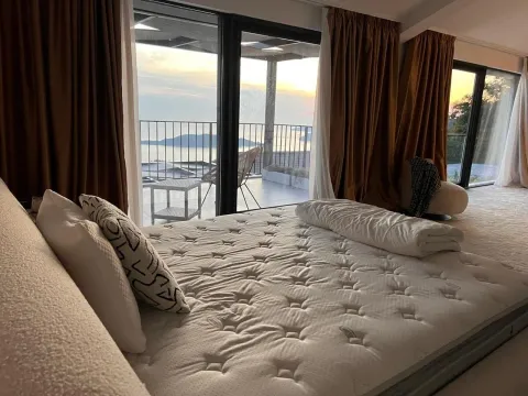 Spacious bedroom with a large double bed and a sea view. - image 8