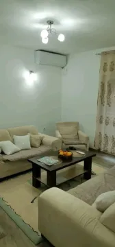 Bright living room with comfortable sofas and a coffee table. - image 3