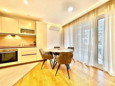 Bright kitchen with a dining area and balcony access. - image 15
