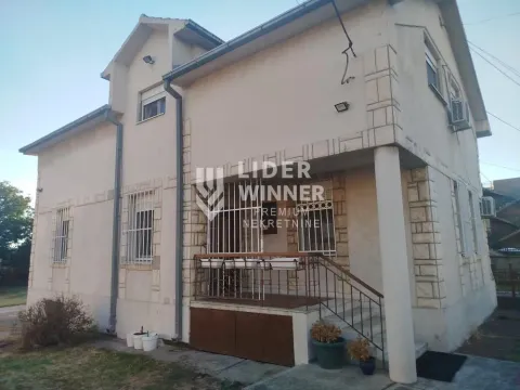 View of the exterior of the house with an entrance staircase and yard. - image 4