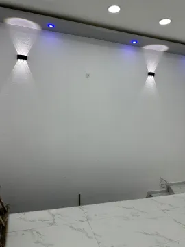 Empty white room with recessed lighting and ceramic tile flooring. - image 6