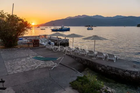 View of the beach and bay at sunset. - image 3