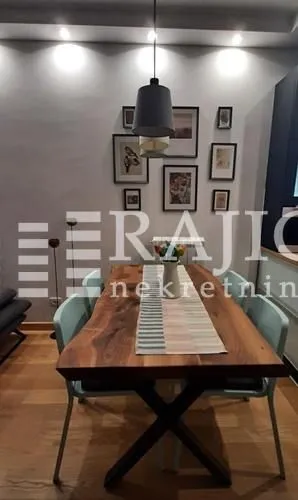 Dining room with a wooden table and chairs.