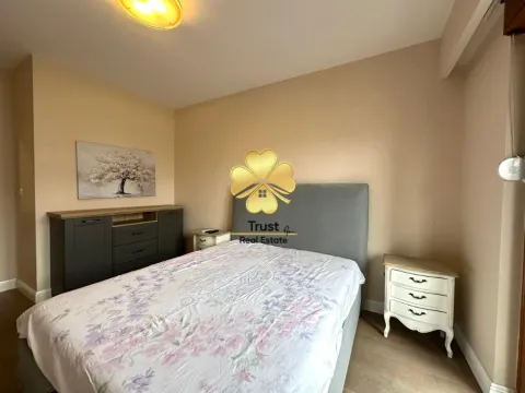 Furnished bedroom with a double bed, dresser, and a nightstand. - image 12