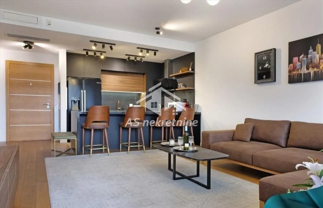Living room connected with kitchen and dining area.