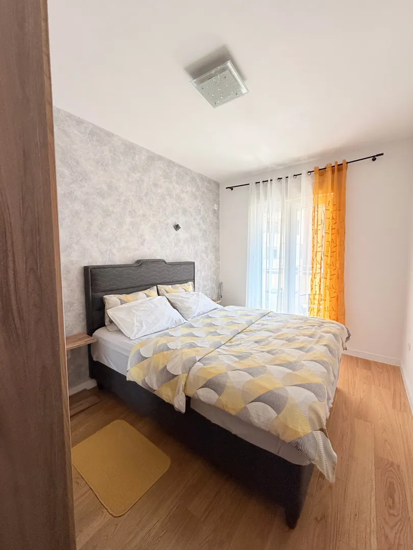 Furnished bedroom with a double bed.