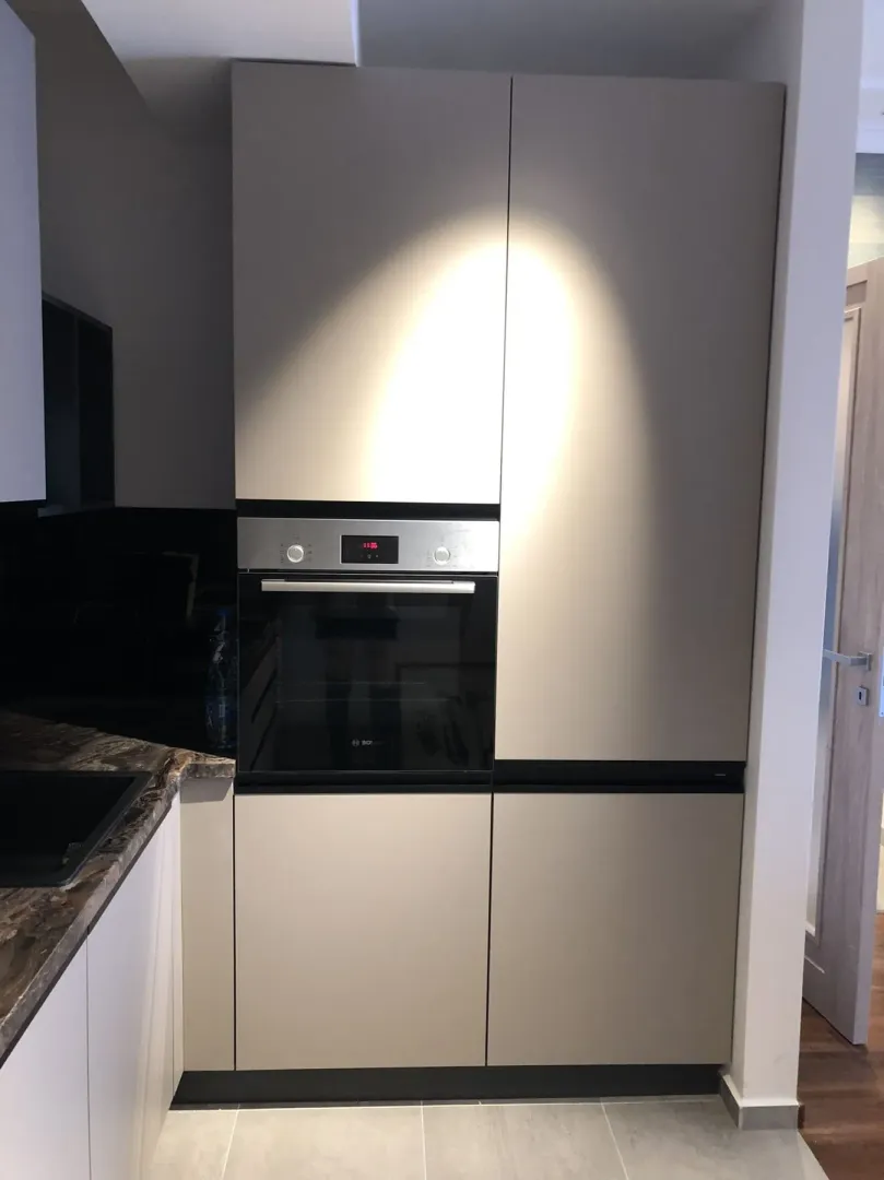 Built-in oven and kitchen cabinets with a modern design.