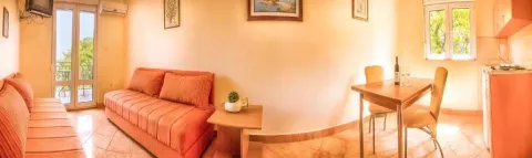 Living room with a sofa set and a dining table. - image 9