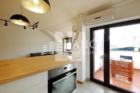 Modern kitchen with built-in oven and access to the terrace. - image 7