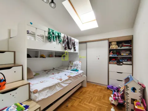 Children's bedroom with a bunk bed and a skylight. - image 10