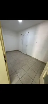 Empty room with white walls and a tiled floor. - image 10