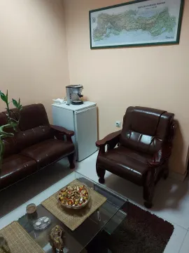 A room with leather furniture and a coffee table. - image 5