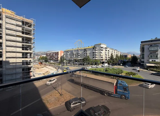 View from the terrace of the city street and surrounding buildings.