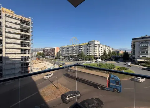 View from the terrace of the city street and surrounding buildings. - image 3