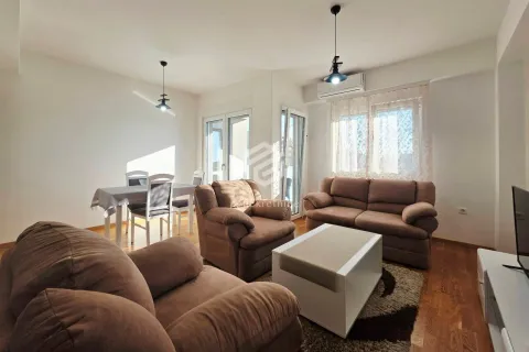 Living room with a sofa set, coffee table, and a dining area in the background. - image 4