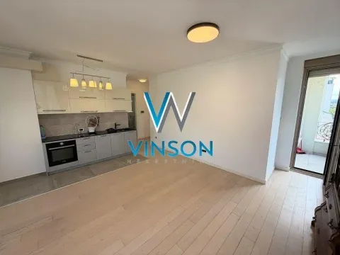 Smaller kitchen with an open layout in the living room. - image 3