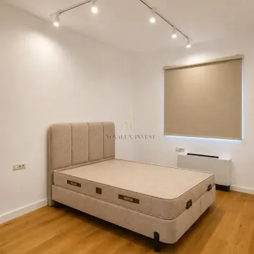 Bedroom with a double bed, hardwood flooring, and recessed ceiling lighting. - image 8