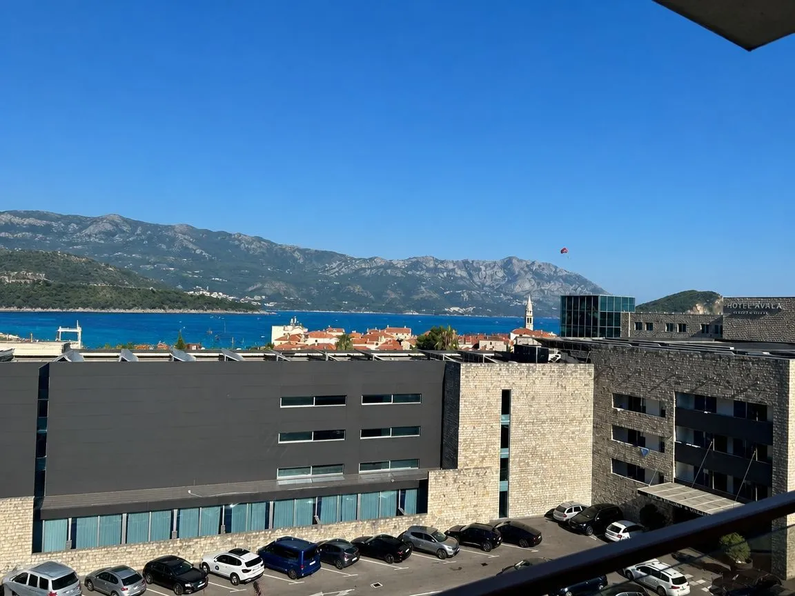 View from the terrace overlooking the city, sea, and mountains.