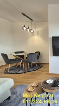 Living room with a dining area and seating furniture. - image 7