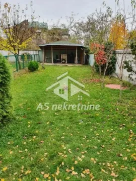 Green yard with lawn and a wooden canopy in the background. - image 8