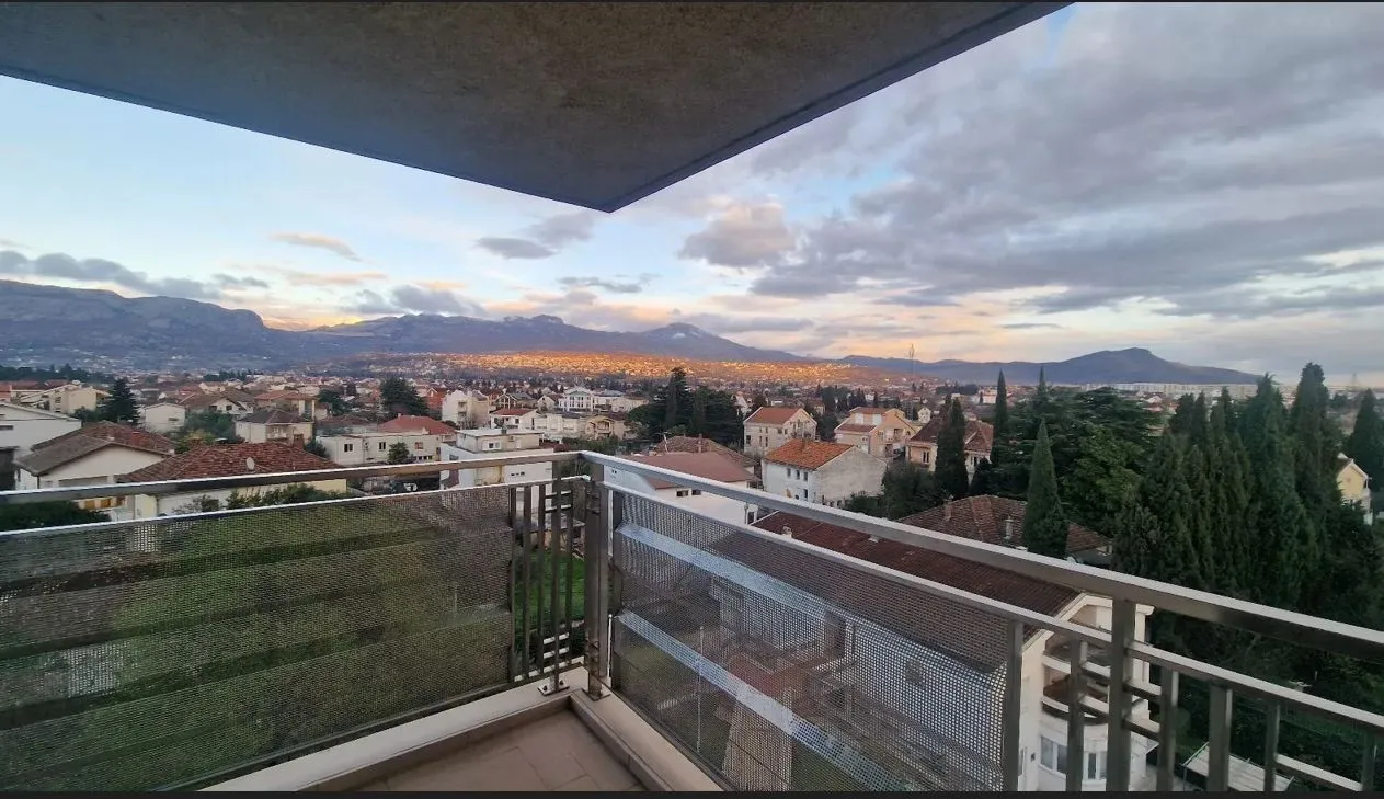 View from the balcony overlooking the neighborhood and distant mountains.