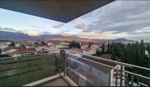 View from the balcony overlooking the neighborhood and distant mountains. - image 15