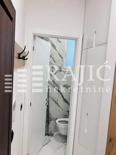 View of the bathroom through the door from the hallway.