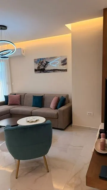 Modern living room with a sofa and armchair.