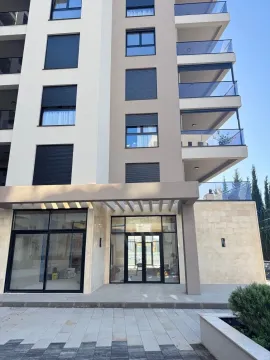 Exterior view of a modern residential building with balconies and the entrance area. - image 7
