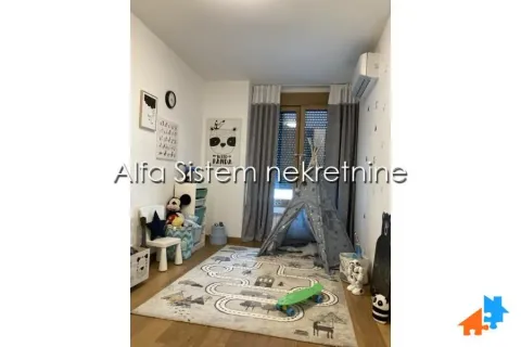 Children's bedroom with a play tent and patterned rug. - image 12