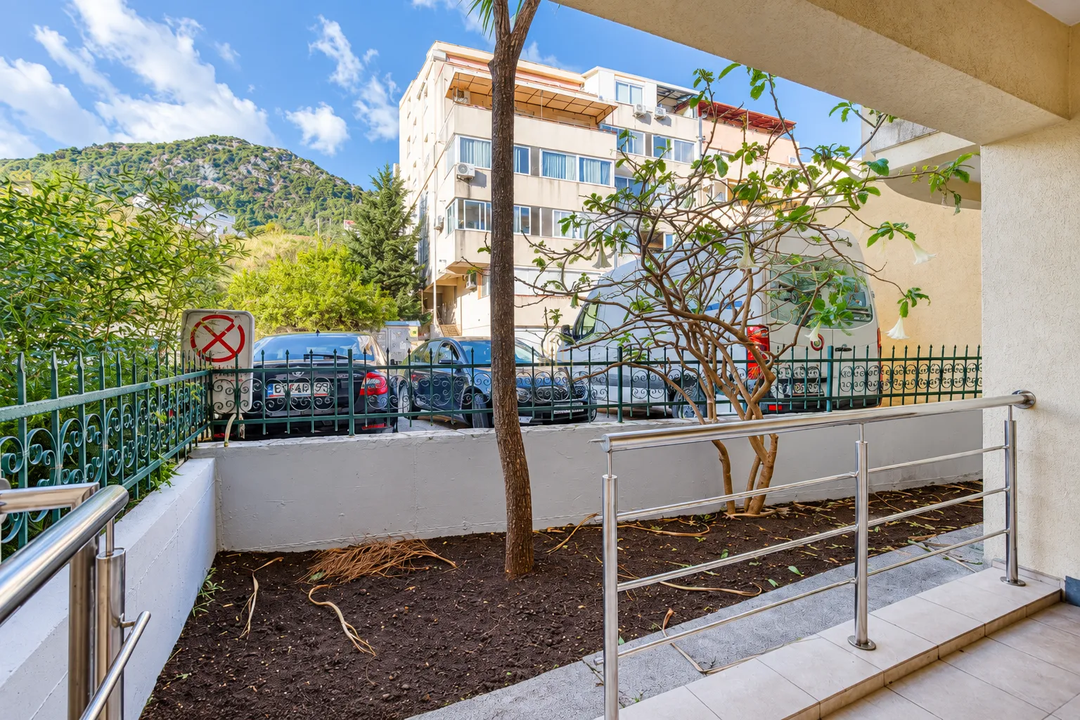 View from the terrace towards the yard and surrounding buildings.