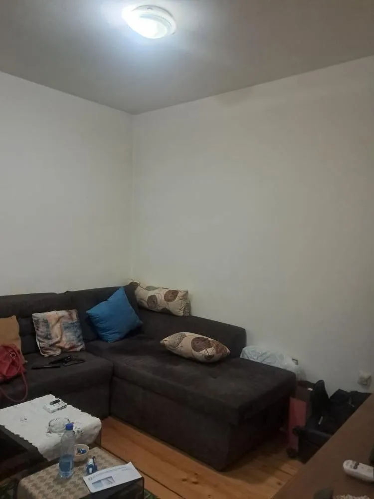 Corner sofa in the living room with cushions.