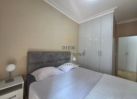 Furnished bedroom with a double bed and a fitted wardrobe. - image 7