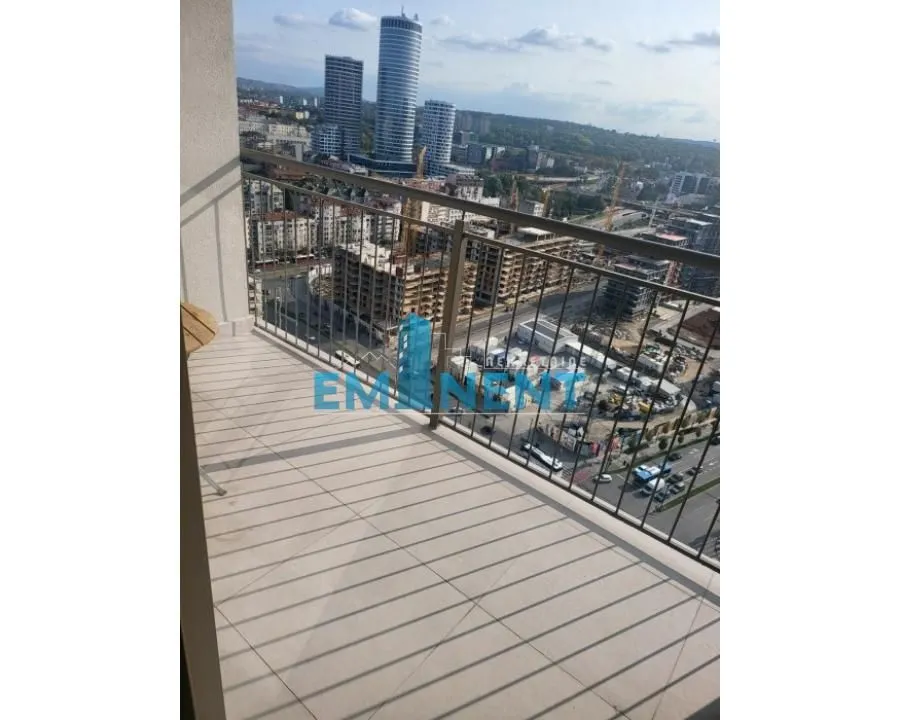 View of the city and tall buildings from the balcony.