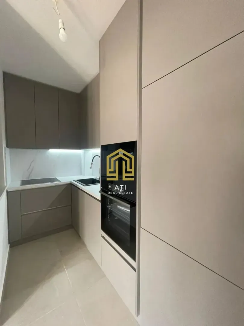 Modern kitchen with built-in cabinetry and appliances.