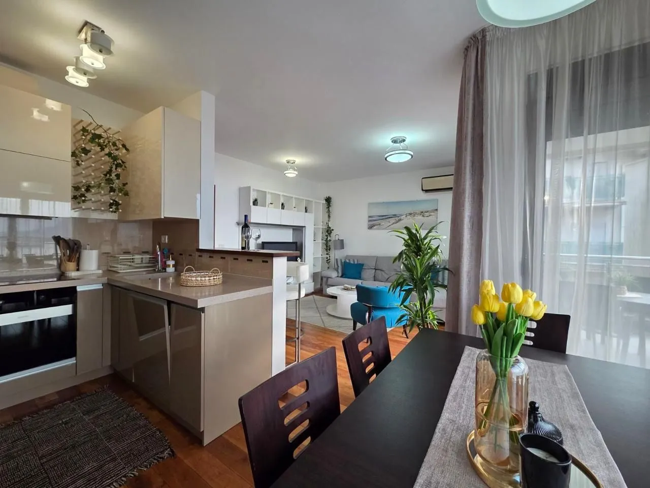Living room connected to the dining area and kitchen.