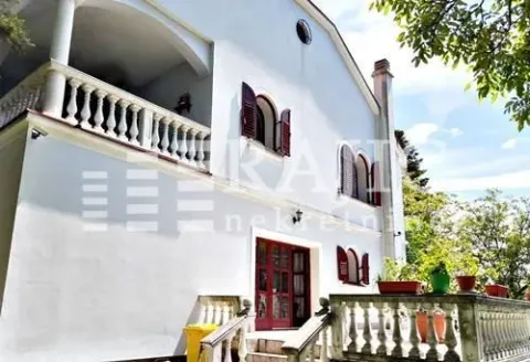 Exterior view of the house with a white facade and terrace. - image 4