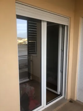 Sliding balcony door with shutters on a terrace. - image 8