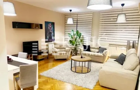 Spacious living room with a sofa set, dining table, and modern lighting. - image 2
