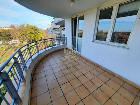 Spacious semicircular balcony with tiled flooring and a metal railing. - image 5
