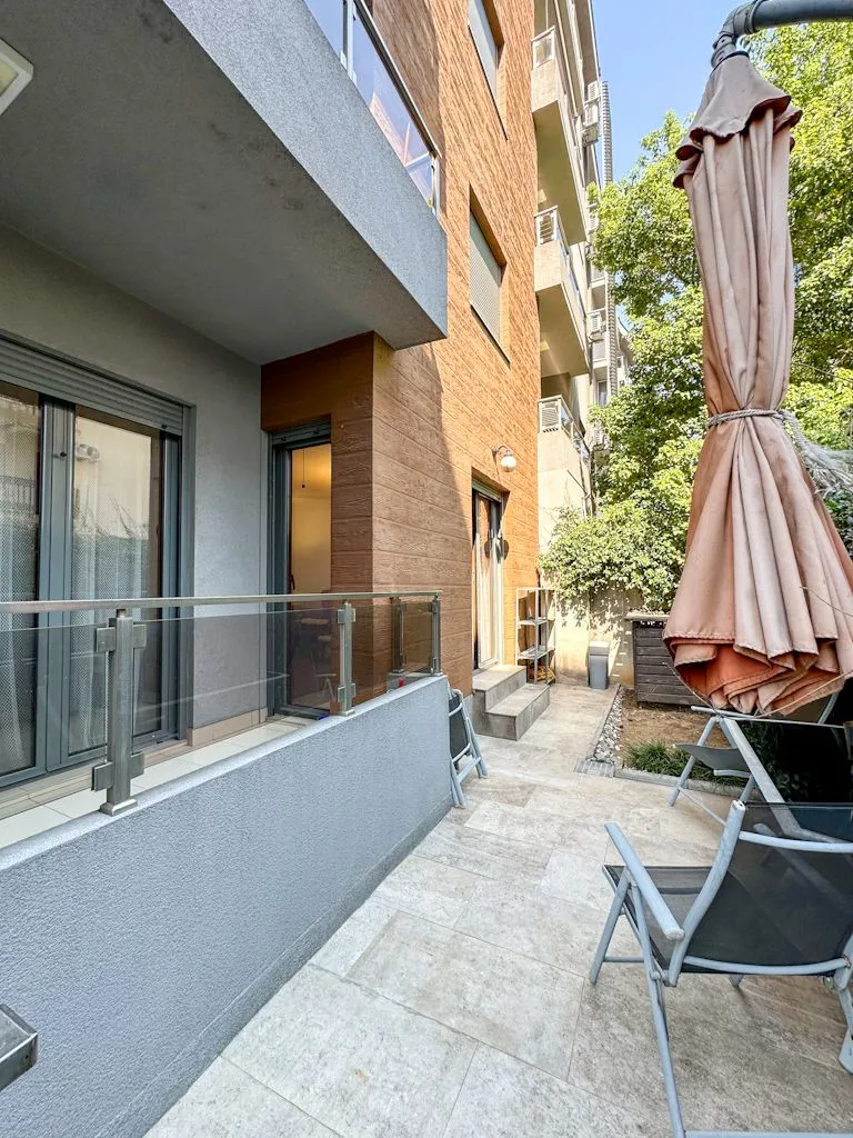 Terrace with paved flooring and patio furniture.