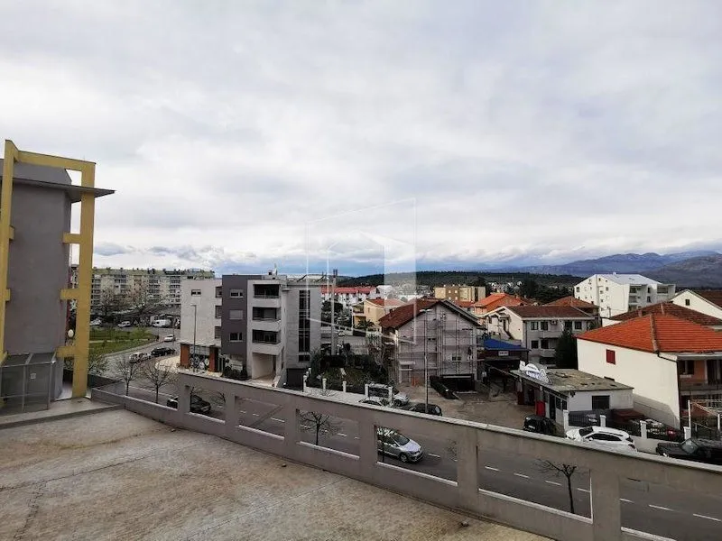 View from the terrace overlooking surrounding buildings and the cityscape.