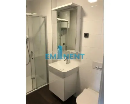 Bathroom with a shower cabin, washbasin, and mirror. - image 5